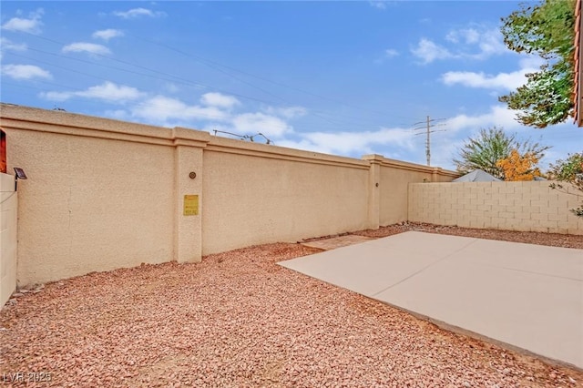 view of yard featuring a patio and a fenced backyard