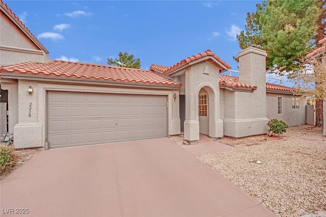 mediterranean / spanish-style home featuring an attached garage, driveway, a chimney, and stucco siding