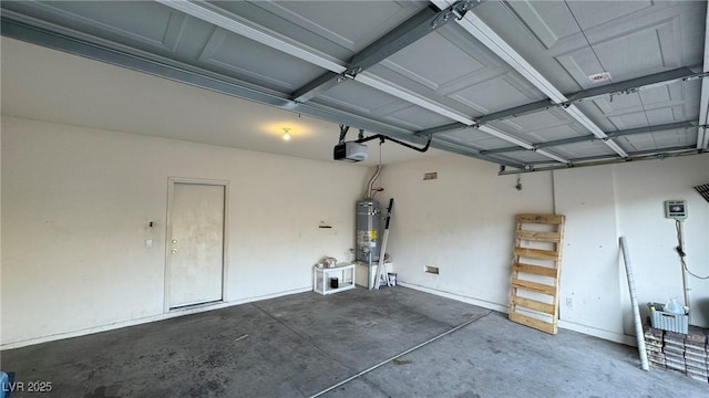 garage featuring water heater and a garage door opener