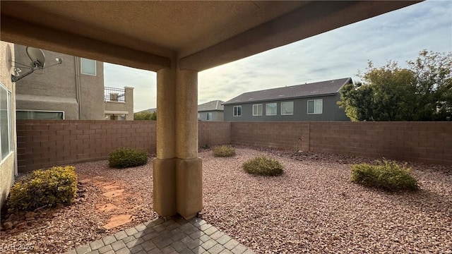 view of yard featuring a patio area and a fenced backyard