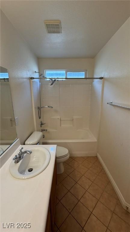 bathroom with toilet, tub / shower combination, vanity, and visible vents