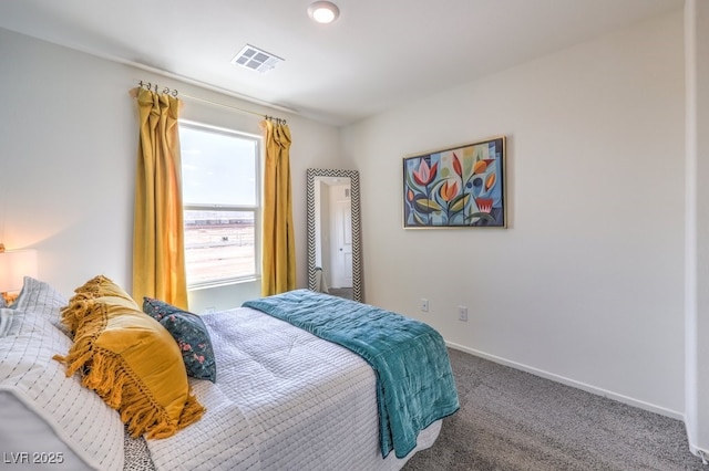 carpeted bedroom with baseboards and visible vents