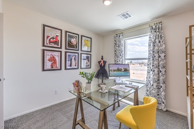 carpeted office with visible vents and baseboards