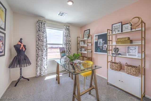 carpeted office featuring visible vents and baseboards