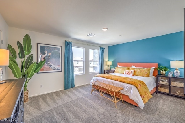 bedroom featuring baseboards, visible vents, and carpet flooring