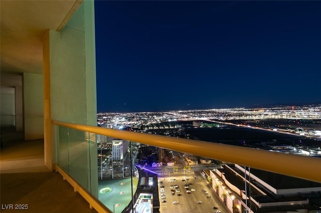 balcony at night with a view of city lights