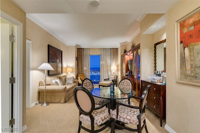 dining space featuring baseboards and ornamental molding