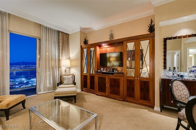 sitting room featuring ornamental molding and baseboards