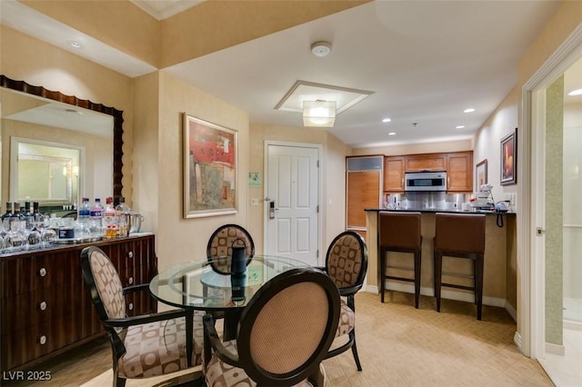 dining room with recessed lighting