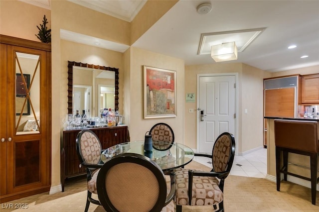 dining area with baseboards and recessed lighting