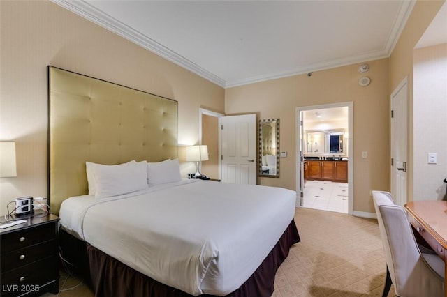 bedroom with ornamental molding, ensuite bath, and baseboards