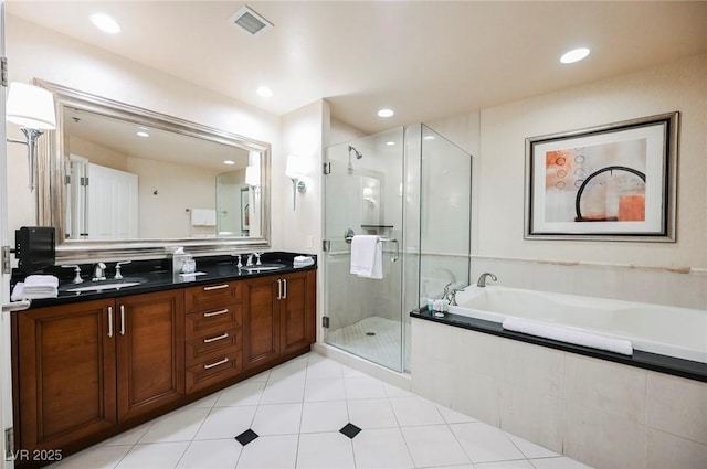 bathroom with double vanity, visible vents, a stall shower, a sink, and a bath