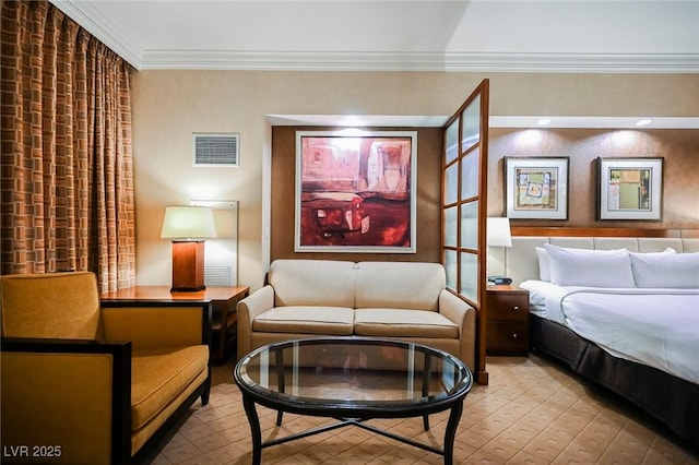 bedroom with visible vents and crown molding