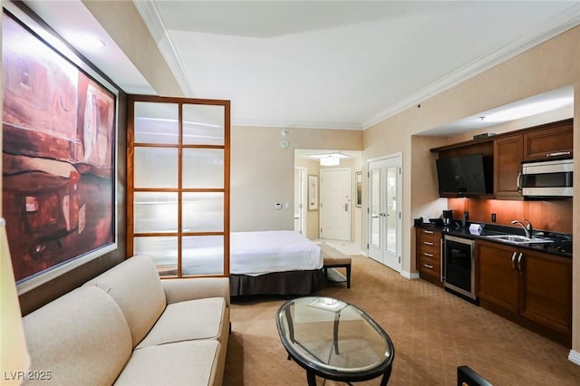 bedroom with light colored carpet, beverage cooler, a sink, french doors, and ornamental molding