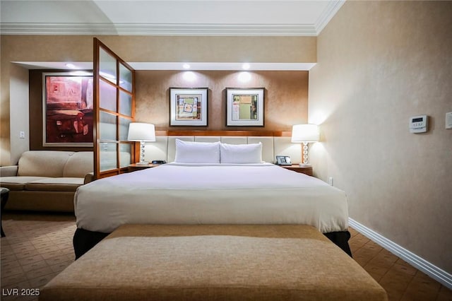 bedroom with baseboards and crown molding