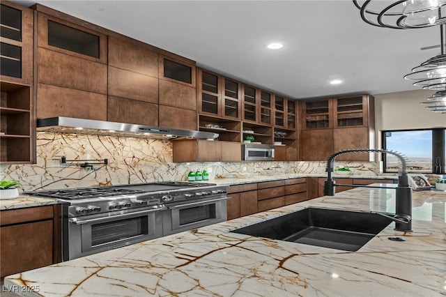 kitchen featuring a sink, open shelves, tasteful backsplash, appliances with stainless steel finishes, and extractor fan