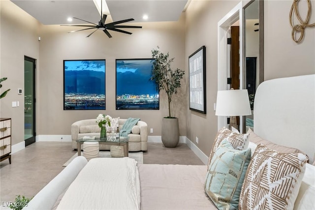 living room featuring a ceiling fan, baseboards, finished concrete floors, and recessed lighting