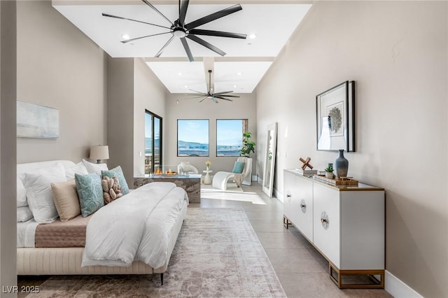 bedroom featuring light tile patterned flooring, baseboards, a towering ceiling, and recessed lighting