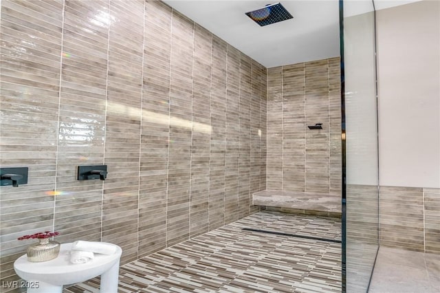 bathroom with a tile shower