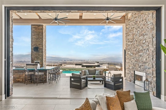 view of patio with outdoor dry bar and an outdoor hangout area