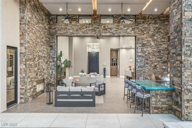 view of patio featuring an outdoor hangout area, ceiling fan, and outdoor dry bar