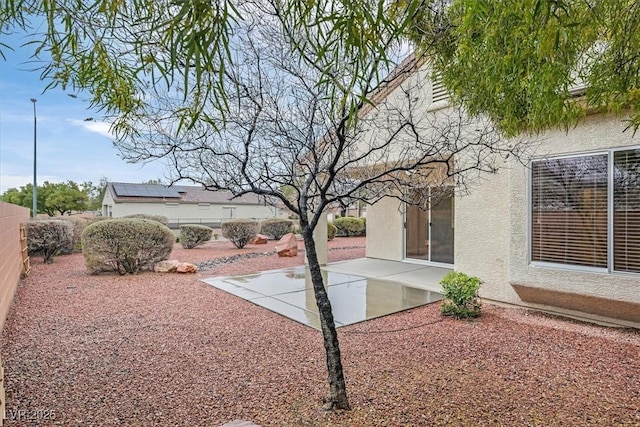 view of yard with a patio and fence