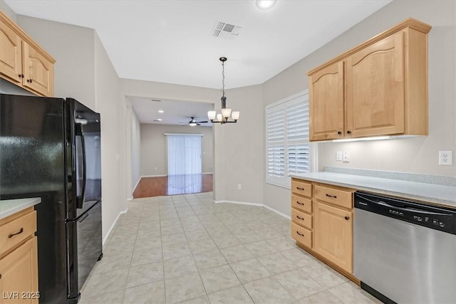 kitchen featuring freestanding refrigerator, light countertops, dishwasher, and light brown cabinetry