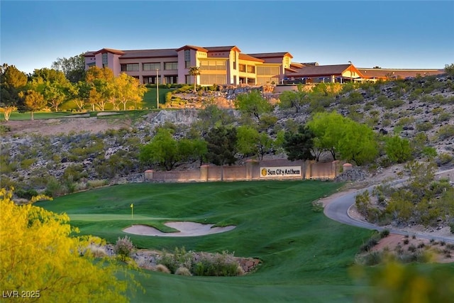 view of property's community featuring view of golf course