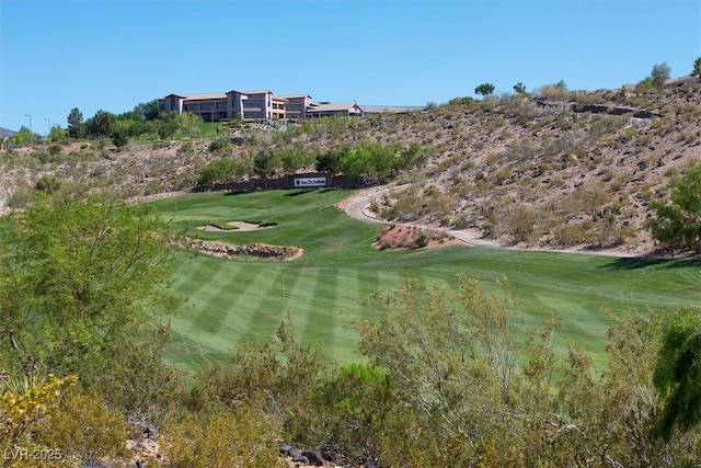 exterior space with a yard and golf course view