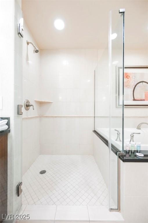 145 E Harmon Ave Unit 2503, Las Vegas, NV 89109 - bathroom featuring a stall shower and vanity