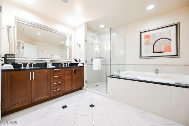 145 E Harmon Ave Unit 2503, Las Vegas, NV 89109 - bathroom featuring double vanity, recessed lighting, a stall shower, a sink, and a bath