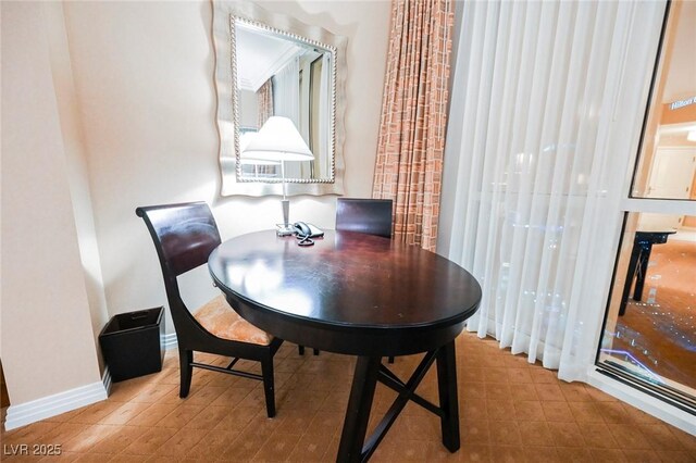 145 E Harmon Ave Unit 2503, Las Vegas, NV 89109 - dining area with baseboards
