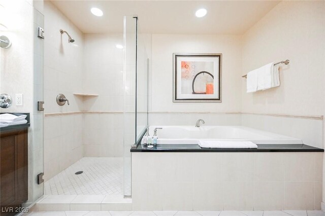 full bath with recessed lighting, a shower stall, a bath, and vanity