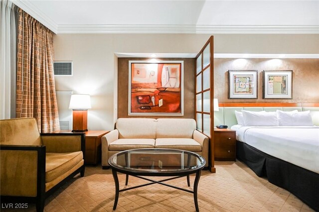 bedroom with visible vents and ornamental molding