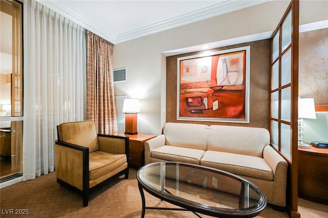 sitting room featuring ornamental molding