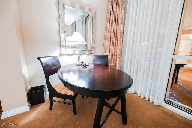 dining room with baseboards