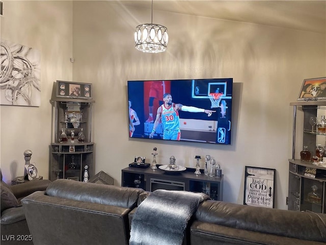 living area featuring a notable chandelier