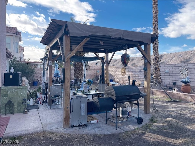 view of community with a gazebo, a patio area, and a fenced backyard