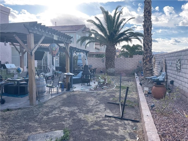 view of property's community with a patio area, a fenced backyard, and a pergola