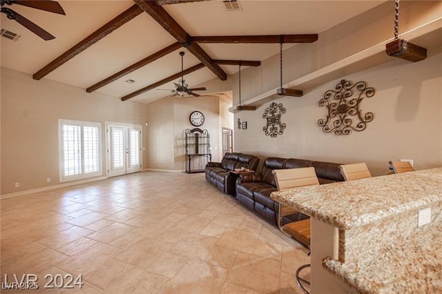 living area featuring ceiling fan, high vaulted ceiling, beamed ceiling, and visible vents