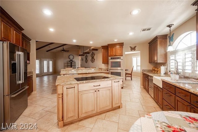 kitchen featuring visible vents, open floor plan, stainless steel appliances, a sink, and recessed lighting