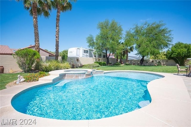 view of pool with a patio area, a pool with connected hot tub, a fenced backyard, and a yard