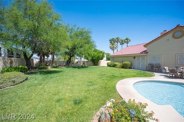 view of yard with a fenced backyard and a patio