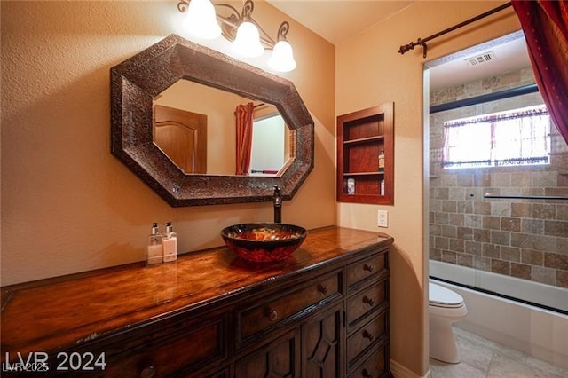 full bathroom featuring toilet, visible vents, combined bath / shower with glass door, and vanity