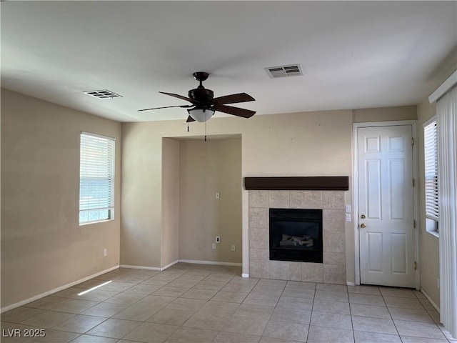 2461 Brooklyn Bridge St, Las Vegas, NV 89135 - unfurnished living room featuring ceiling fan, light tile patterned floors, and a fireplace