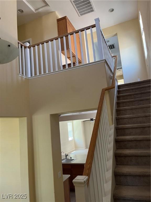 2461 Brooklyn Bridge St, Las Vegas, NV 89135 - stairway featuring a high ceiling