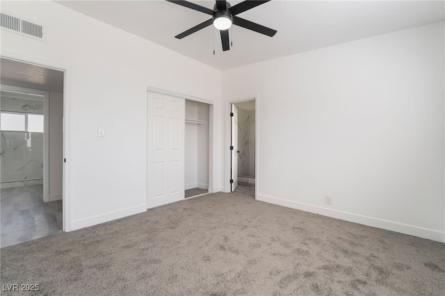 unfurnished bedroom featuring a closet, baseboards, visible vents, and carpet flooring