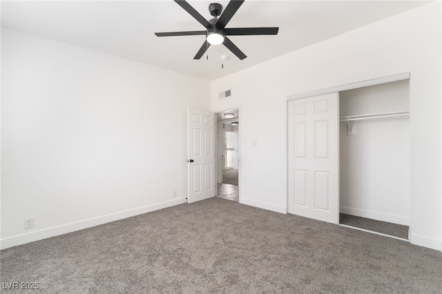 unfurnished bedroom featuring ceiling fan, carpet flooring, visible vents, baseboards, and a closet