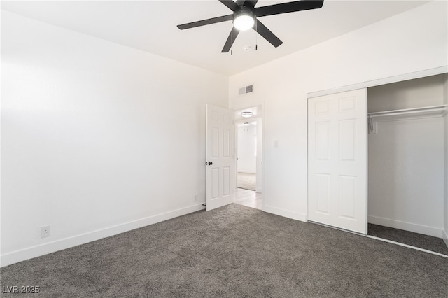 unfurnished bedroom with visible vents, baseboards, a ceiling fan, carpet, and a closet