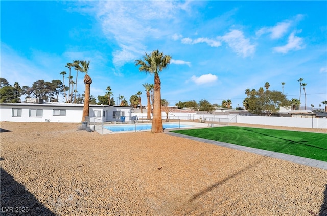 view of yard with a fenced in pool, fence private yard, and a patio area